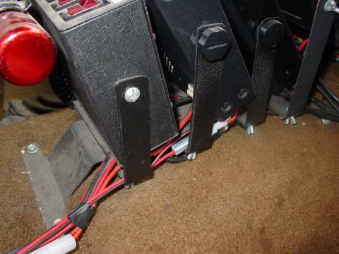 1989 Ford Bronco - Close up of the base of the rack, mounted to the floor with 4 screws to the trans access pannel. Made of 16ga steel with rattle can paint j…