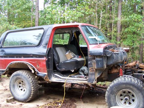 1979 Ford F-150 - This two-door SUV, likely a Ford Bronco from the late 1970s, is shown in a state of disrepair with its front end removed.