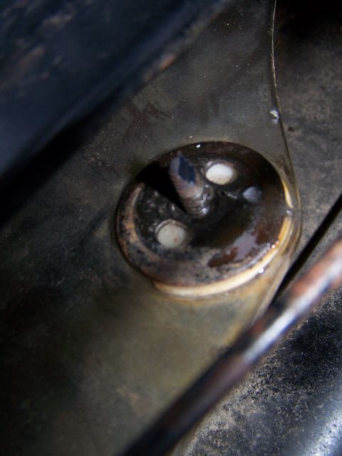 1979 Ford F-150 - Detail of a corroded metal bracket, likely from the underside of a vehicle.