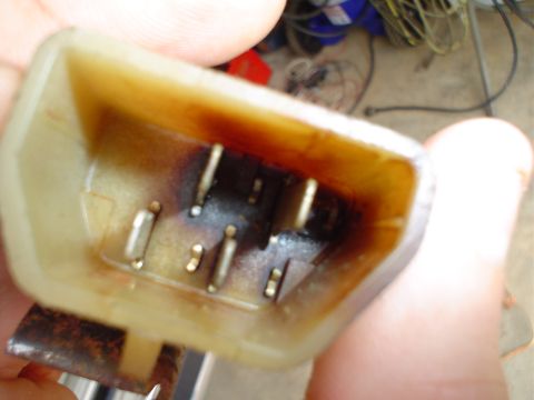 1984 Ford Bronco - This electrical connector shows signs of significant heat damage and corrosion on its pins.