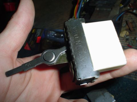 1984 Ford Bronco - Ignition switch assembly with key, showing 'MADE IN USA' marking. This part is likely from a vehicle interior.