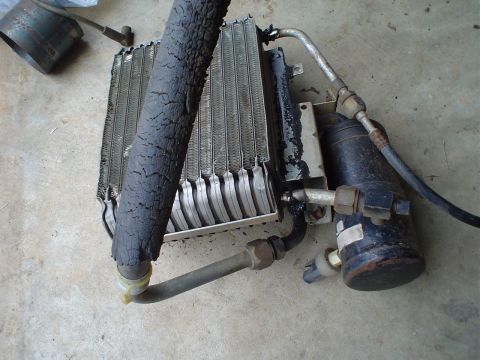 1984 Ford Bronco - This automotive part appears to be an AC condenser and receiver-drier assembly, likely removed from a vehicle for repair or replacement.