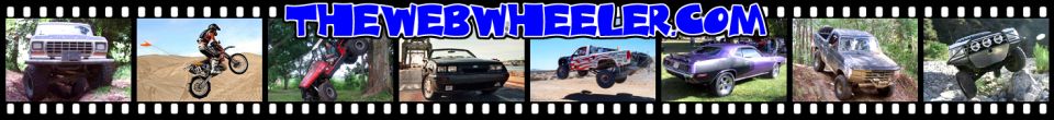 Front view of a lifted Jeep Cherokee XJ with large tires on a dirt path