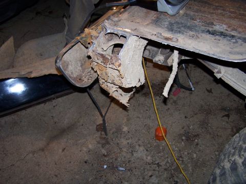 1979 Ford F-150 - Close-up view of heavily corroded vehicle frame, indicating significant wear and tear.