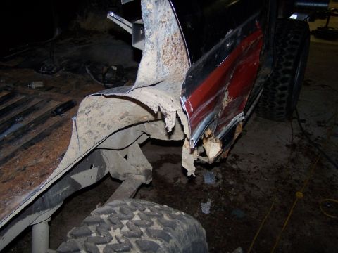 1979 Ford F-150 - The rear bodywork of this truck is severely corroded and appears to be undergoing repair or has sustained significant damage.