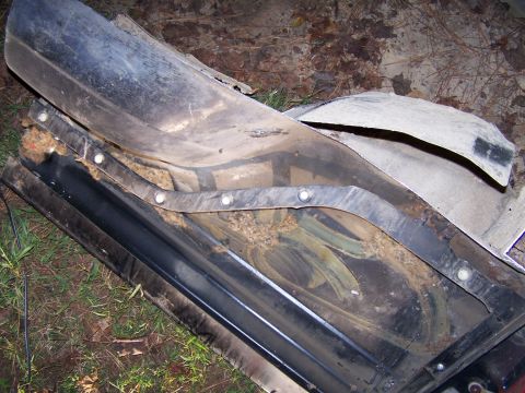 1979 Ford F-150 - Close-up view of a disassembled truck fender liner, revealing its internal structure and worn condition.