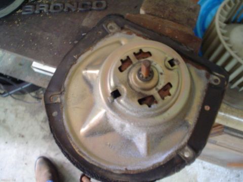 1984 Ford Bronco - Blower motor assembly removed from a vehicle for repair or replacement.
