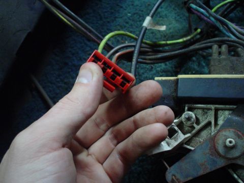 1984 Ford Bronco - Close-up of a red electrical connector and associated wiring.
