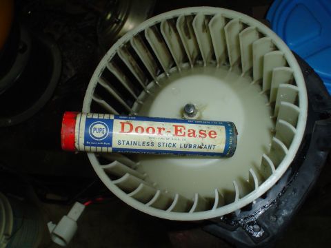 1984 Ford Bronco - A blower motor fan is shown with a tube of Door-Ease stainless stick lubricant. The registry claims this is from a 1984 Ford Bronco interio…