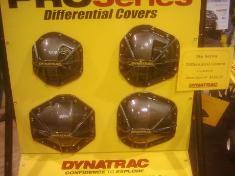 1978 Ford Bronco - Dynatrac Pro Series differential covers are displayed at an expo, with pricing information visible on a yellow tag.