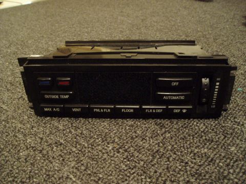 1993 Ford Taurus - This is a climate control unit with various function buttons and a temperature slider.