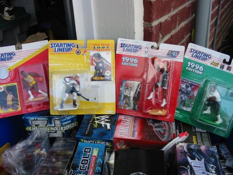 1991 Ford Bronco - Several boxed Starting Lineup sports figures and cards are displayed, along with other toy packaging.