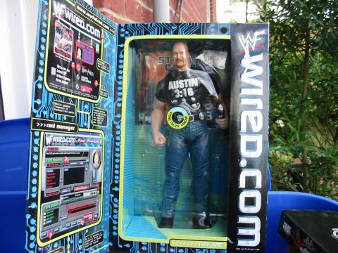 1991 Ford Bronco - WWF action figure of Stone Cold Steve Austin in its original packaging, "Austin 3:16" branding.