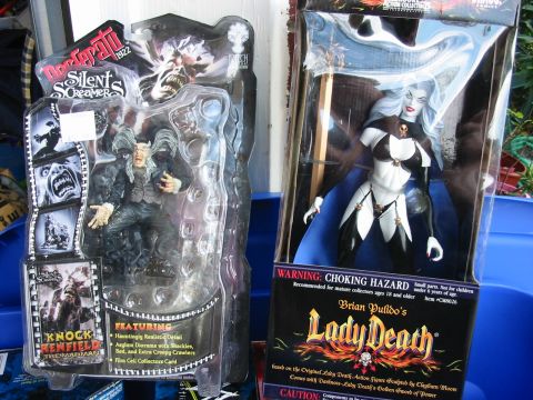 1991 Ford Bronco - Packaged action figures of a monster and Lady Death are displayed side-by-side.