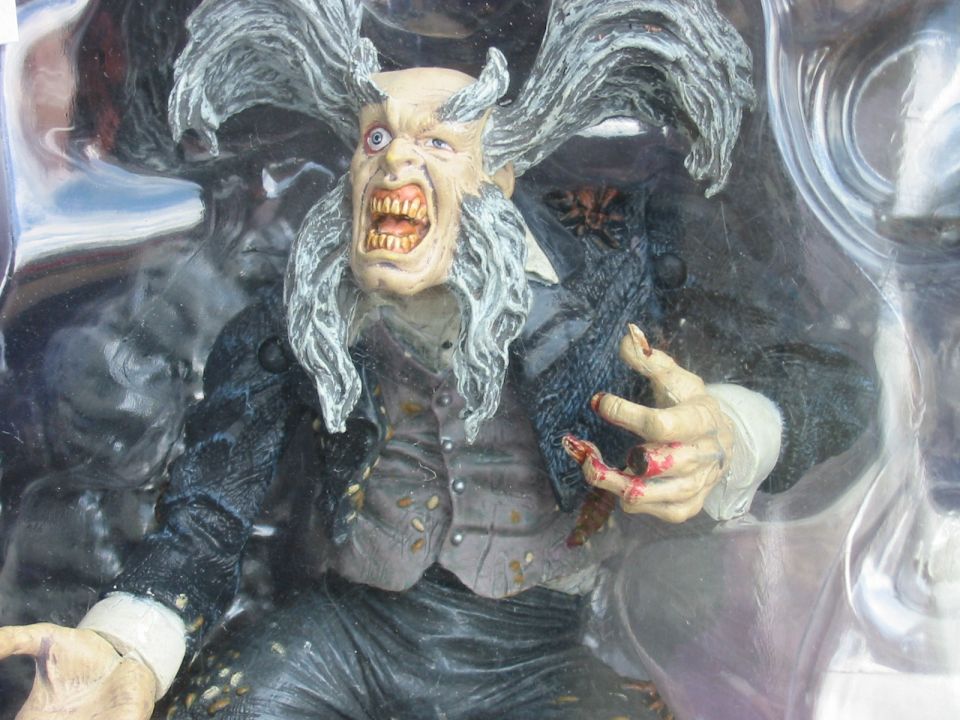 Toy figure with wild hair and fangs