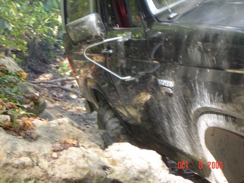 1986 Ford Bronco - This vehicle is shown off-roading on a difficult, rocky path.
