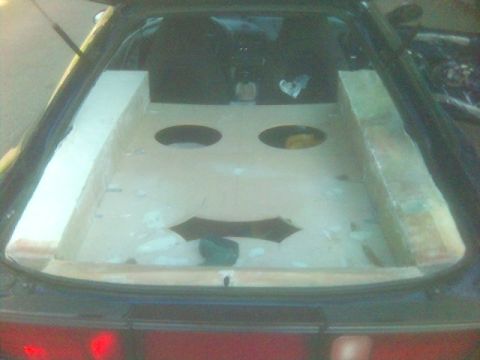 1994 Ford Probe - Custom speaker box installed in the rear of a car, obscuring the view of the seats.