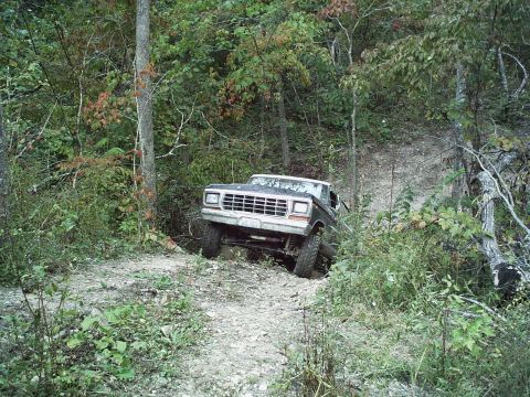 1986 Ford Bronco - This Ford Bronco appears to be from the early 1980s, seen here tackling a off-road path.