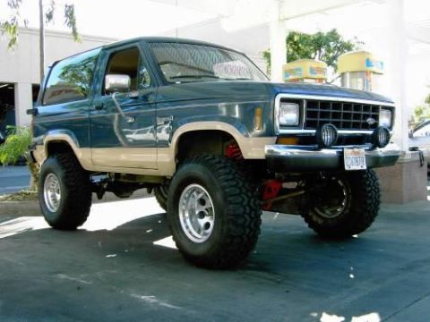 1986 Ford Bronco II - This lifted 1986 Ford Bronco II features a two-tone paint scheme and aggressive off-road tires.