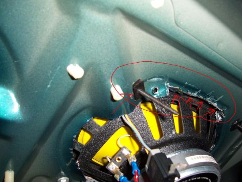 1996 Mercury Sable - Detail of an interior car component, showing wiring and a yellow element, with red markings on the metal.