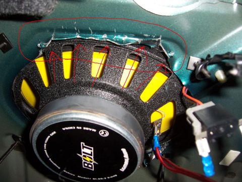 1996 Mercury Sable - Close-up of a car door speaker installation, showing wiring and mounting details.