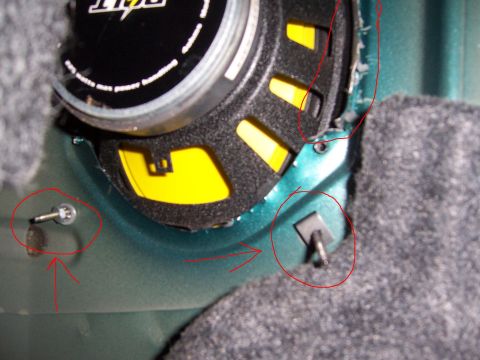 1996 Mercury Sable - Detail shot of speaker mounting hardware and surrounding car interior paneling.