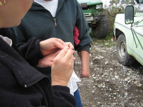 1990 Ford Bronco - Several people are interacting outdoors, with two vehicles visible in the background.