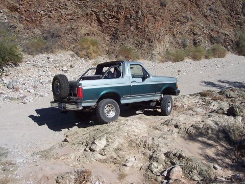 1996 Ford Bronco - This 1996 Ford Bronco is shown off-road in a rocky, desert environment.