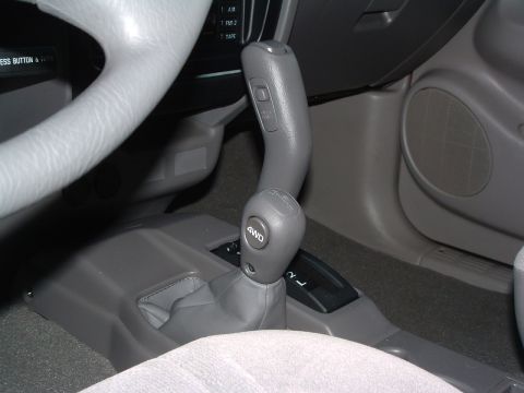 2004 Toyota Tacoma - Interior view of a 2004 Toyota Tacoma, focusing on the 4WD shifter and dashboard details.
