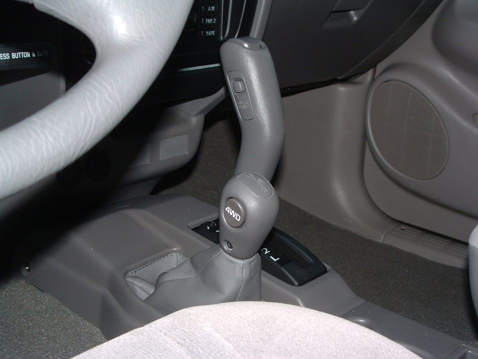 2004 Toyota Tacoma interior showing 4WD shifter and part of steering wheel