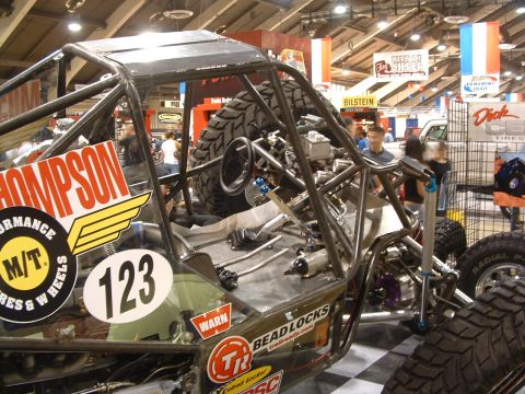 2004 Toyota Tacoma - This custom off-road buggy features a prominent roll cage and large, aggressive tires.