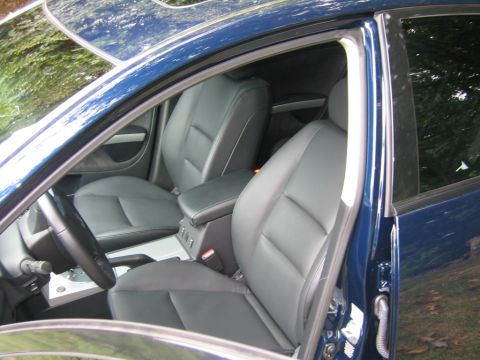 2005 Nissan Maxima - Interior view of a blue car, showing the front seats and dashboard details.