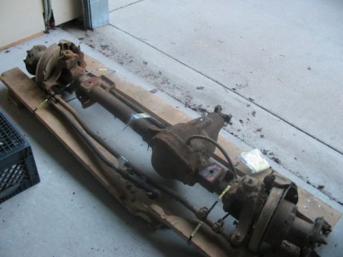 1991 Ford Bronco - A used Dana 60 front axle assembly is shown, mounted on wooden planks.