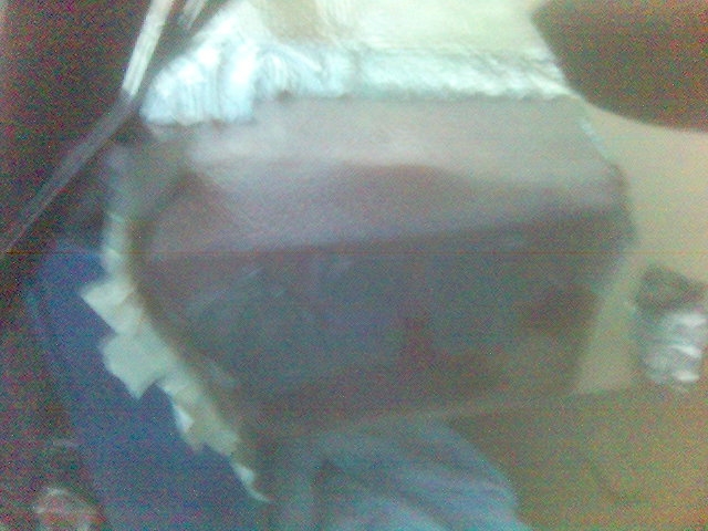 Close-up of car interior with fuzzy white material and dark dashboard