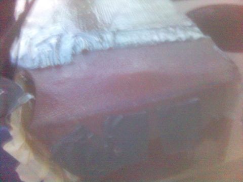 1994 Ford Probe - Close-up view of a car's interior dashboard, partially covered with fabric.
