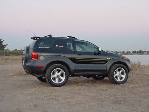 2001 Isuzu Vehicross - This Isuzu VehiCROSS is parked outdoors with a body of water in the background.