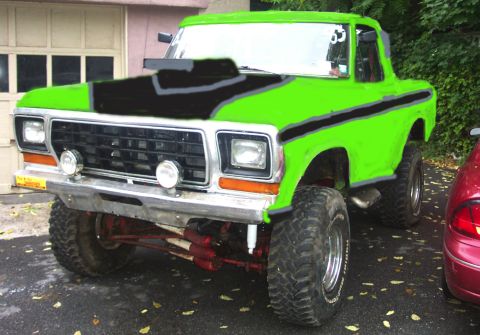 1978 Ford Bronco - This lifted 1978 Ford Bronco features a vibrant green paint job with contrasting black hood scoop and racing stripes.