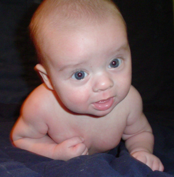 1981 Ford Bronco - Baby looking at the camera with a watermark in the corner.