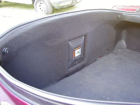 1994 Ford Probe - The trunk of a car features a custom-built enclosure housing a JBL speaker.