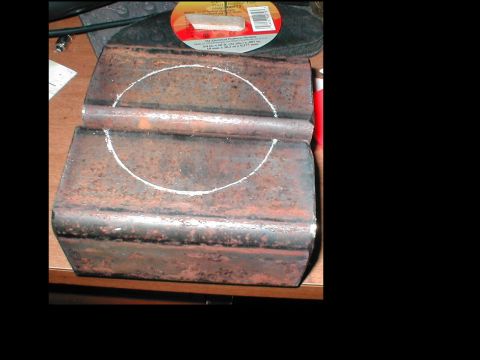 1979 Ford Bronco - A close-up view of a rusty metal component marked with a chalk circle.