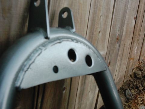 1978 Ford Bronco - Close-up of a fabricated metal bracket with mounting points.