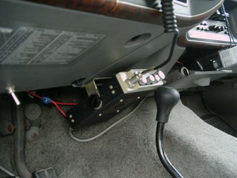 1988 Ford Bronco - CB radio and gear shifter visible inside a vehicle's cabin.