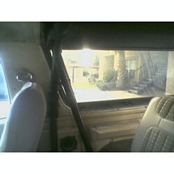 1981 Ford Bronco - View from inside a vehicle, showing the interior and a glimpse of the outside.