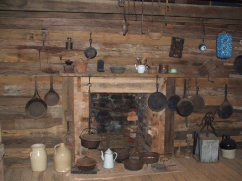 1966 Ford Ranchero - A historical kitchen scene displays antique cookware and pottery around a brick fireplace.