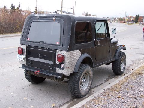 1983 Jeep CJ7 - 1983 Jeep CJ7 with diamond plate rear fender and tailgate accents.
