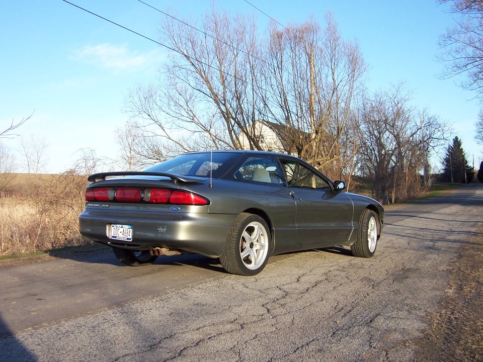 Dark gray 1996 Ford Probe coupe, rear 3/4 view