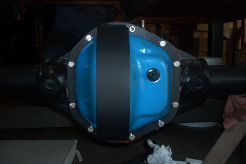 1983 Ford Bronco - A freshly painted differential cover is ready for installation on a vehicle's axle.