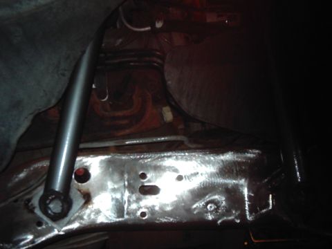1978 Ford Bronco - Undercarriage view of a vehicle's frame and suspension components, showing signs of repair or modification.