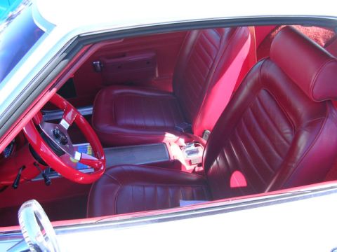 1996 Ford Probe - Interior view of a car with red leather seats and a red steering wheel.