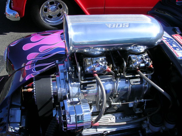 Custom hot rod engine with BDS supercharger and flame paint on fender